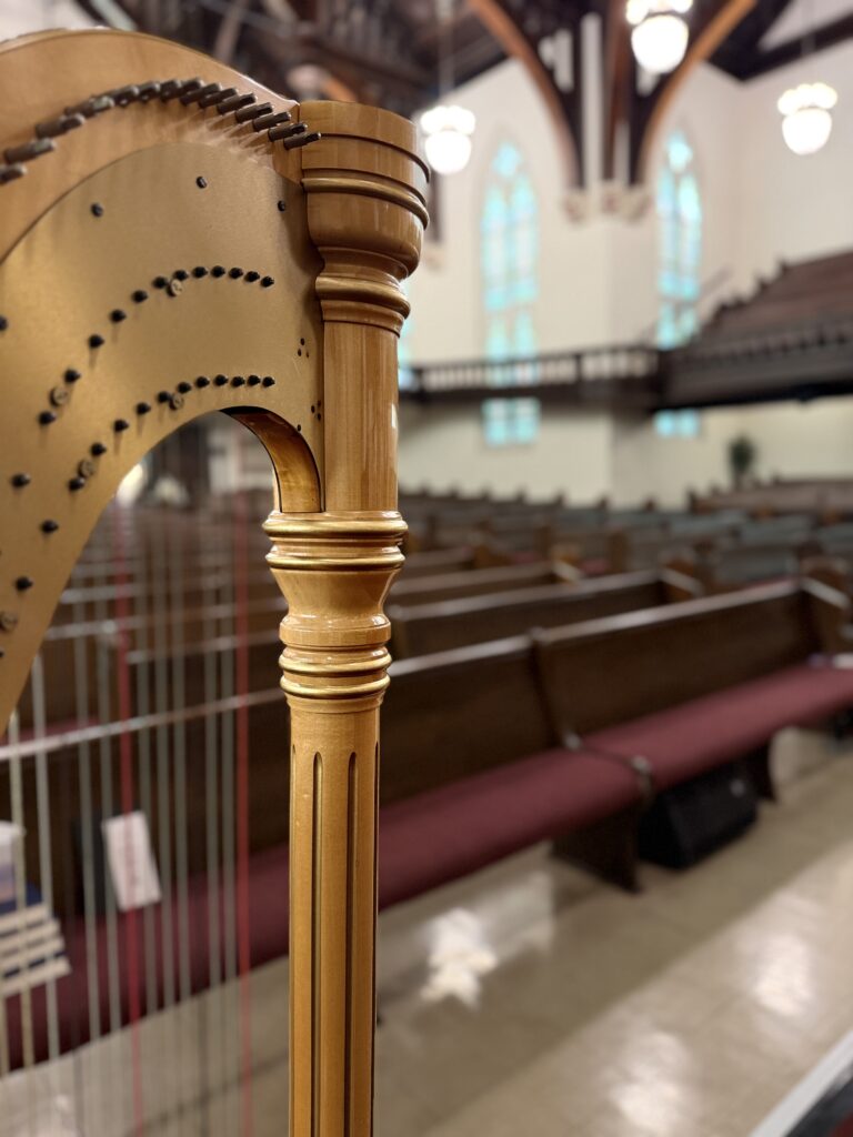 Harpist providing live processional and recessional music for a First Christian Church wedding